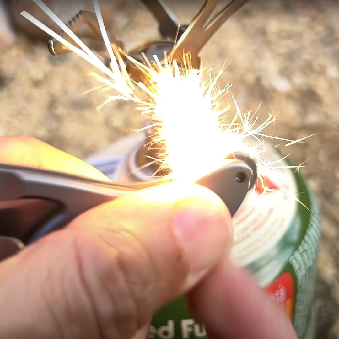 spark fire with the EverSpark Wheel at the butt of the folding feather knife